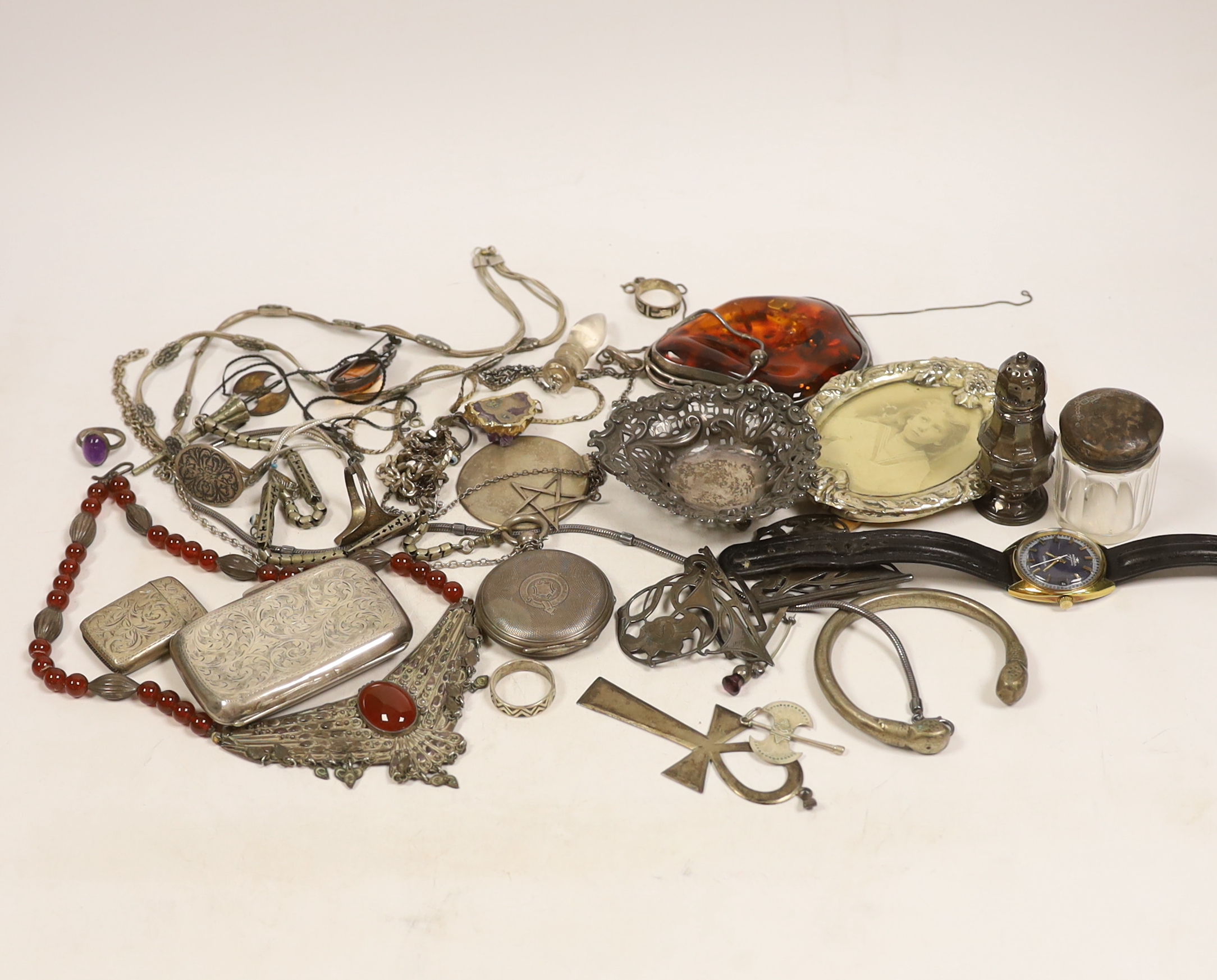 Miscellaneous silver including cigarette case, pepperette, bonbon dish, vesta case and belt buckle, a wrist watch and pocket watch and assorted jewellery including a large sterling mounted amber pendant and a Charles Hor